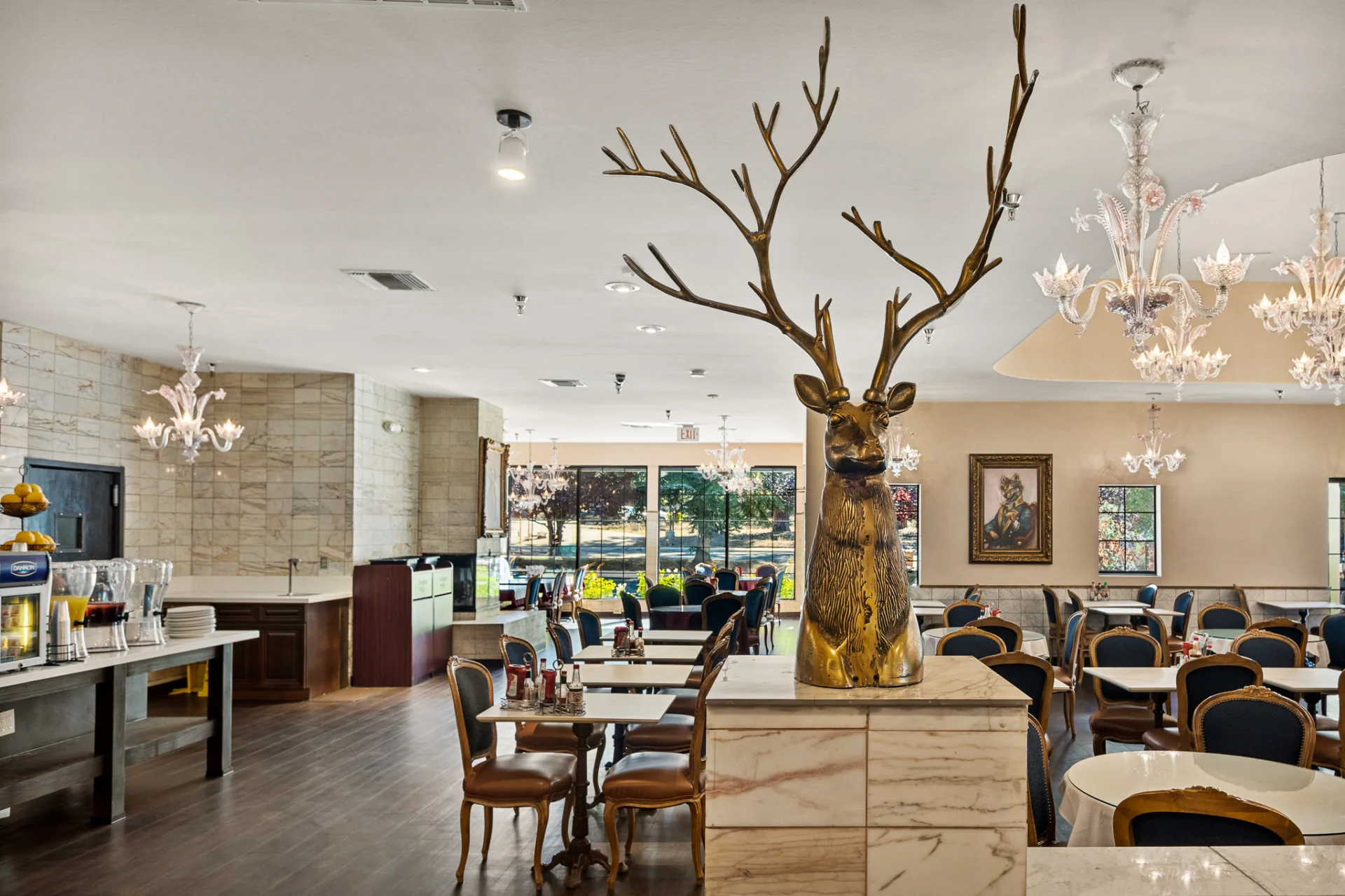 breakfast dining room, buffet, and golden elk statue