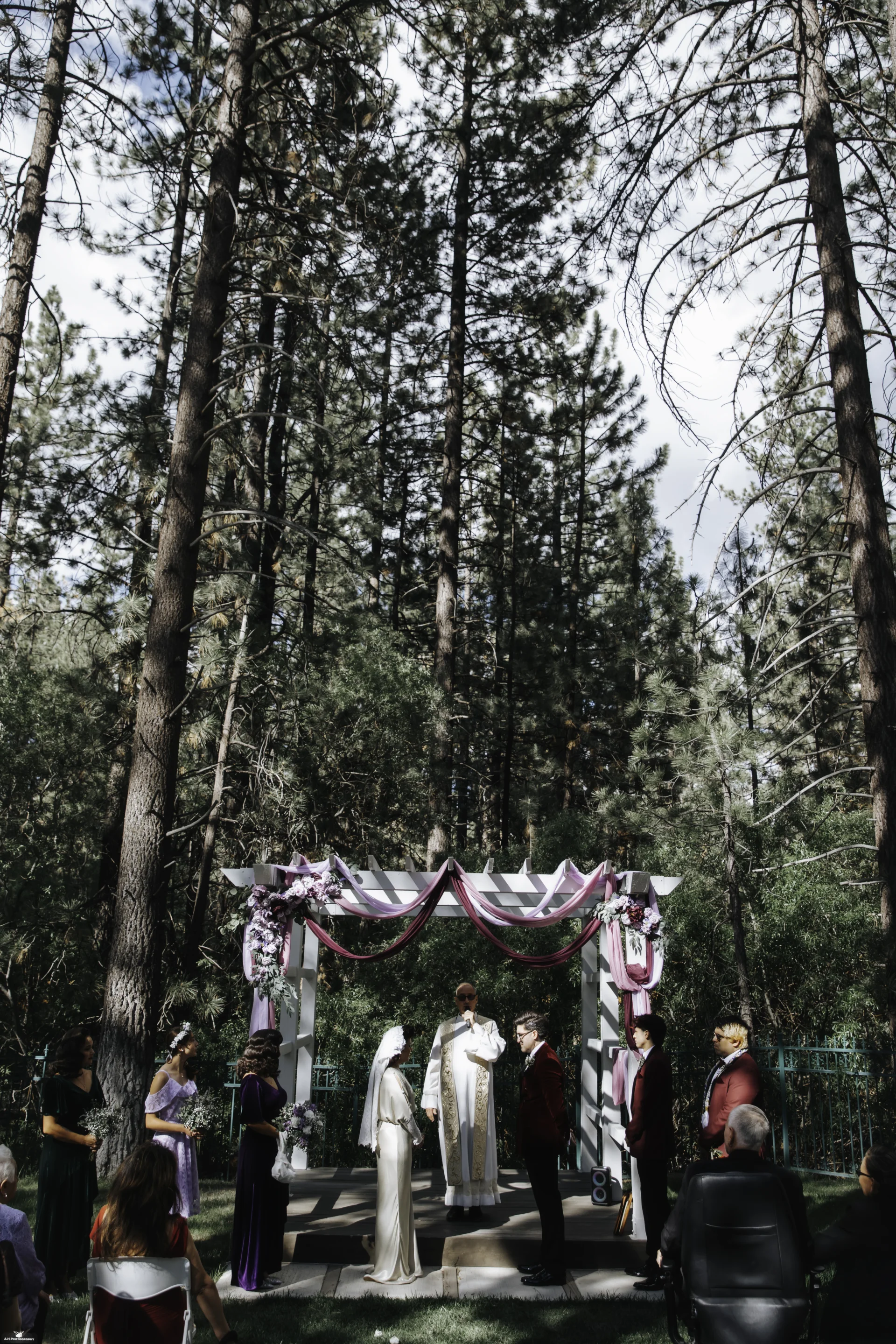 Outdoor pine forest wedding ceremony at Chateau Big Bear, Big Bear Lake CA